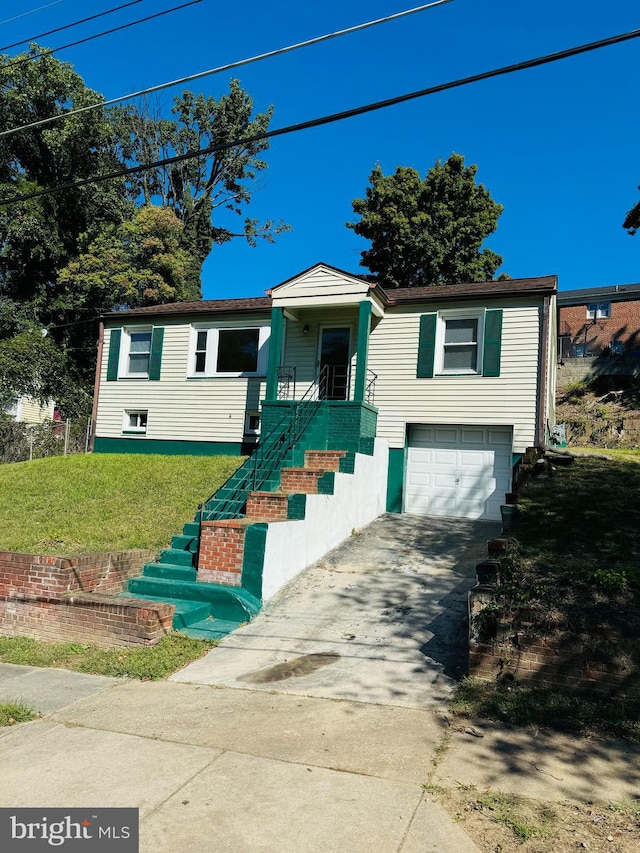 view of front facade with a front lawn and a garage