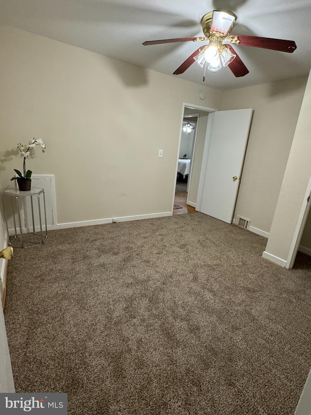 unfurnished bedroom with ceiling fan and carpet flooring