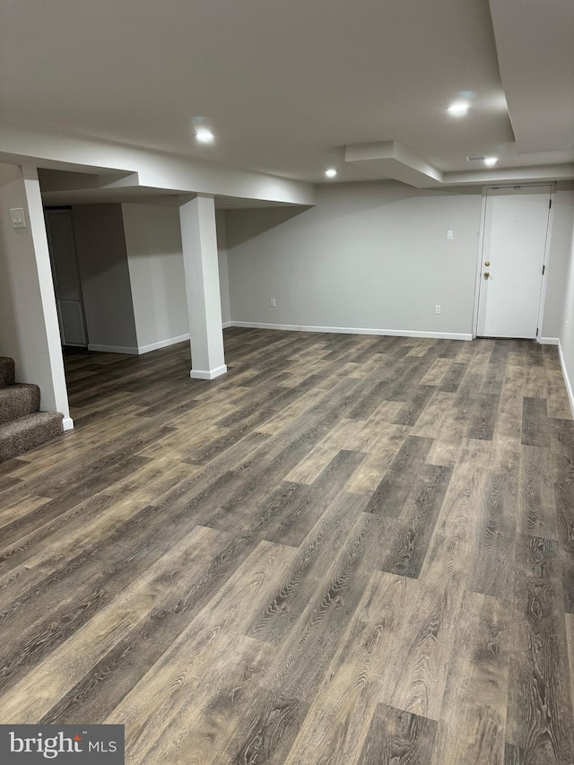 basement featuring dark wood-type flooring