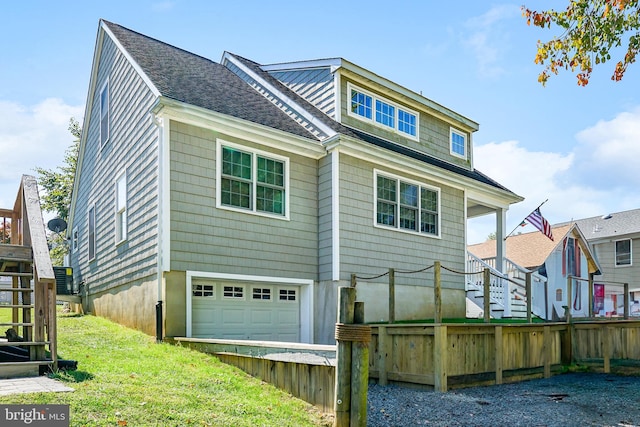 back of house with a garage