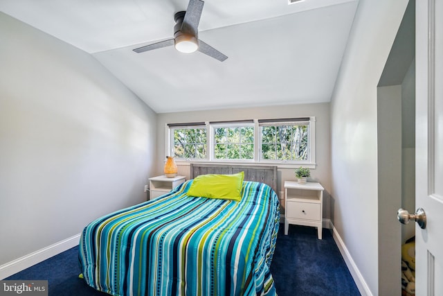 carpeted bedroom with ceiling fan and lofted ceiling