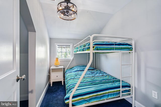 bedroom with vaulted ceiling and carpet flooring