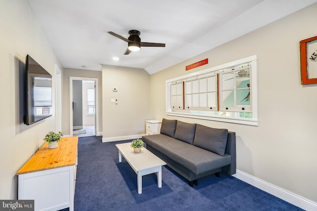 carpeted living room featuring ceiling fan