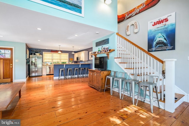 stairway featuring hardwood / wood-style flooring