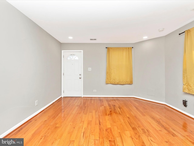 empty room with light hardwood / wood-style floors