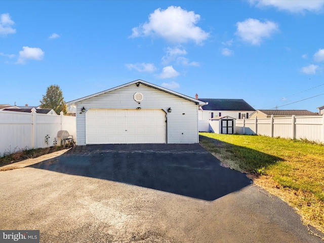 garage featuring a yard