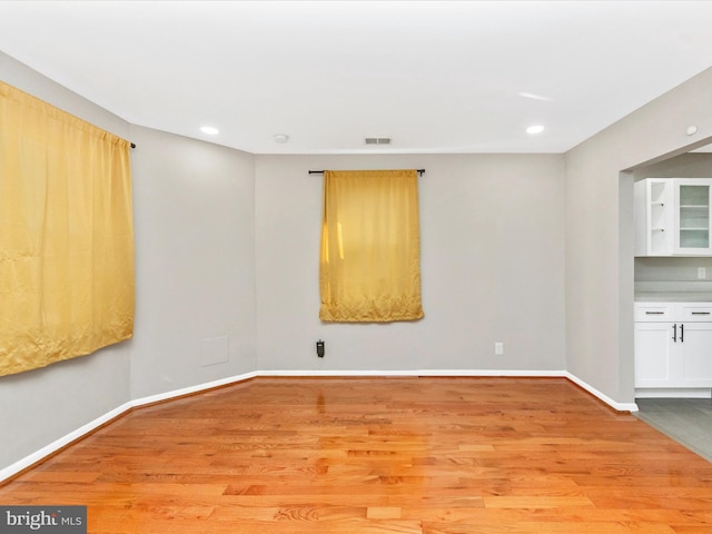 spare room featuring light hardwood / wood-style floors