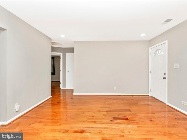 spare room featuring light wood-type flooring