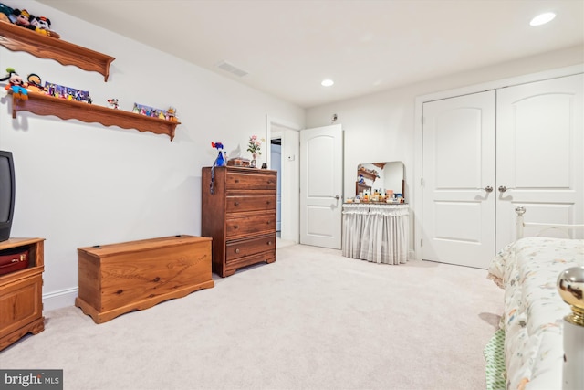 carpeted bedroom featuring a closet