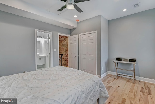 bedroom with ceiling fan, light hardwood / wood-style floors, and connected bathroom