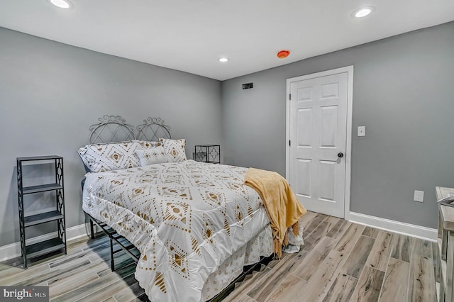 bedroom with light wood-type flooring