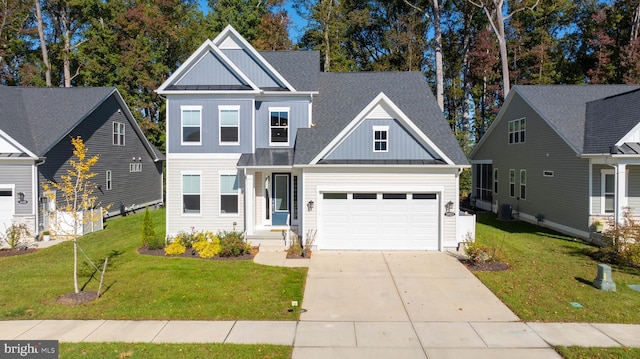 craftsman house featuring a front yard and a garage