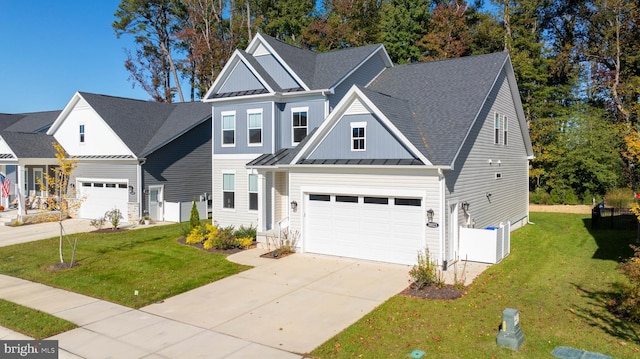 view of front facade with a front yard and a garage