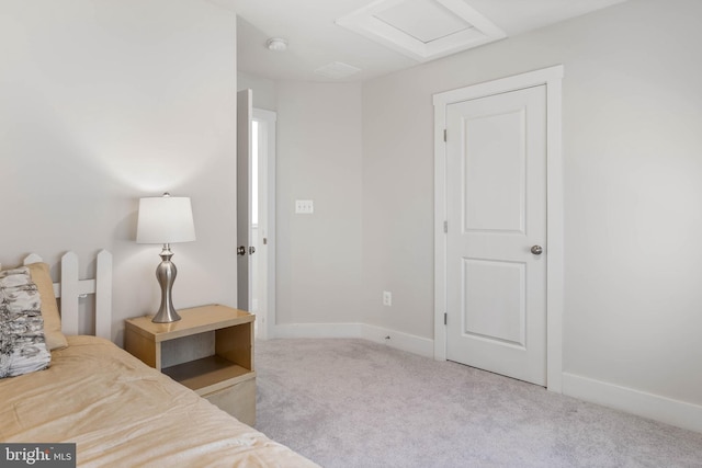 bedroom featuring light carpet