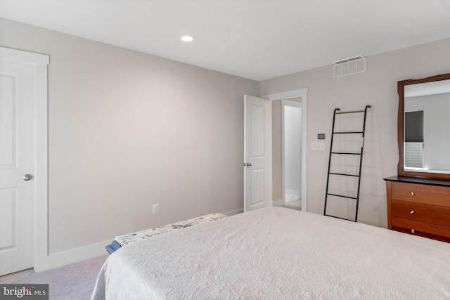 bedroom with light colored carpet