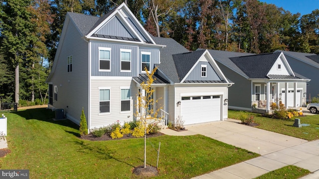 view of front of property featuring covered porch, a front lawn, and a garage