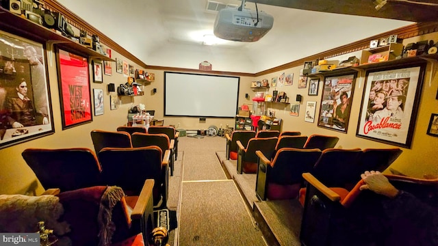 cinema room with crown molding, carpet flooring, and lofted ceiling