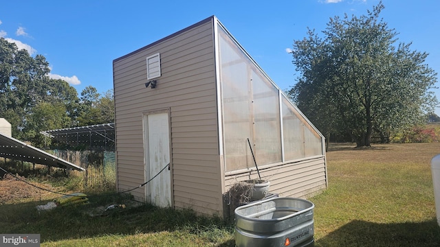 view of outdoor structure featuring a yard