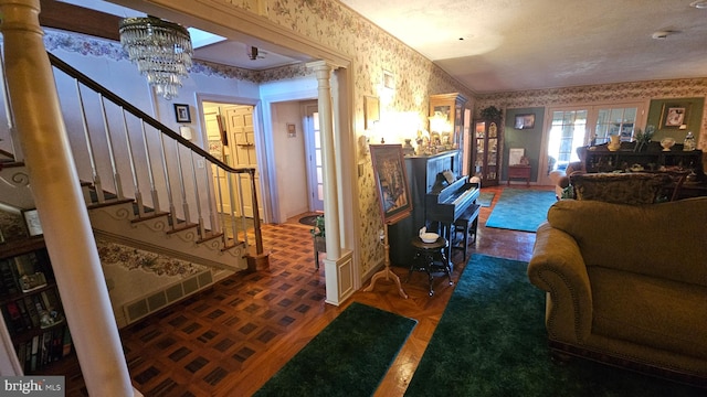 living room with parquet floors and ornate columns