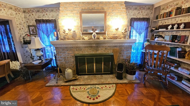 living room featuring crown molding, a brick fireplace, and parquet floors