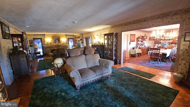 living room with a chandelier and a textured ceiling