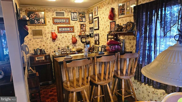 bar with crown molding, a textured ceiling, and dark parquet flooring