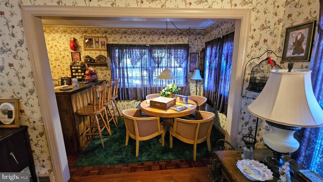 dining room with dark parquet flooring