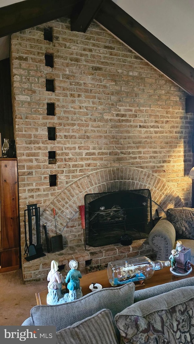 carpeted living room with brick wall and vaulted ceiling