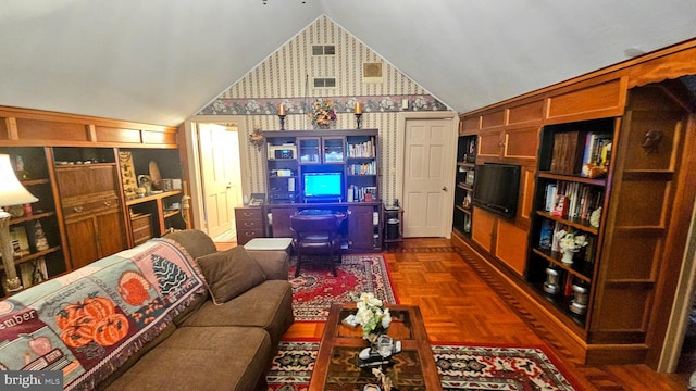 living room featuring dark parquet floors and vaulted ceiling