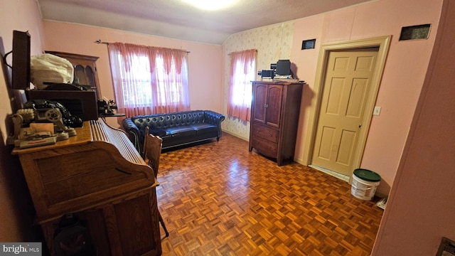 bedroom with dark parquet floors and vaulted ceiling