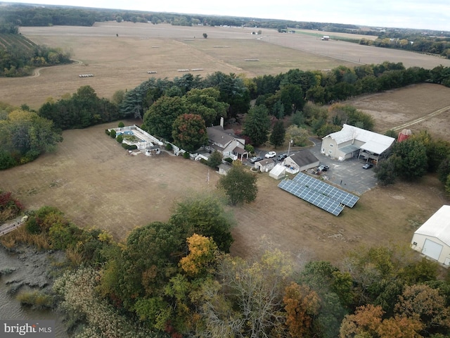 birds eye view of property with a rural view