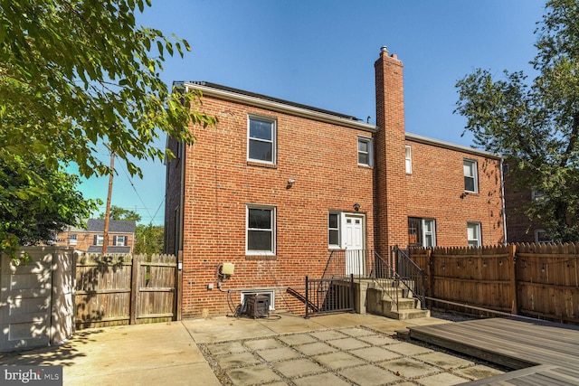 rear view of property with a patio area