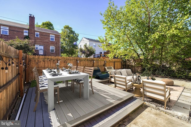 wooden terrace featuring an outdoor hangout area