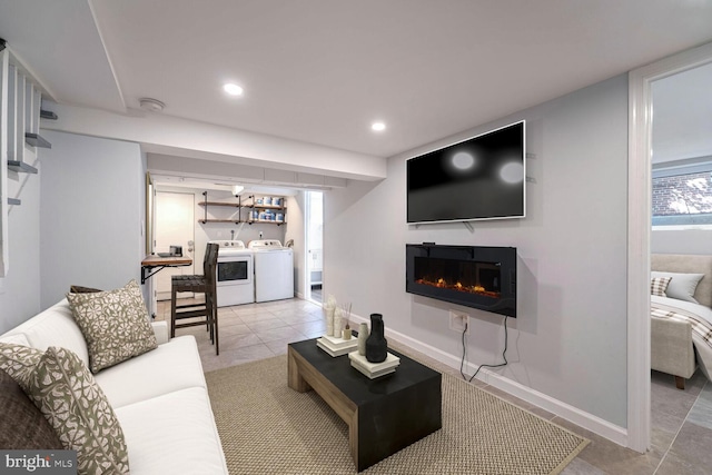 tiled living room with separate washer and dryer