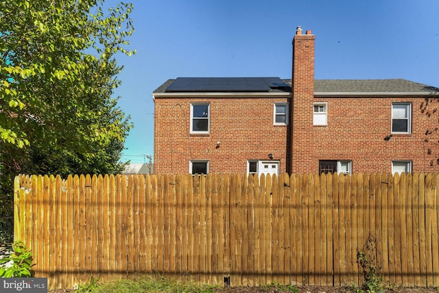 view of home's exterior featuring solar panels