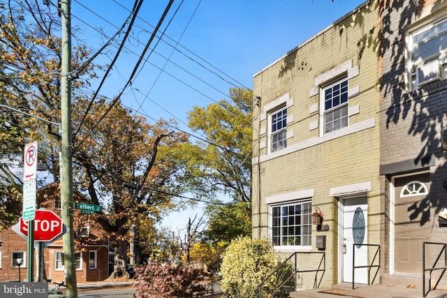 view of front of house featuring brick siding