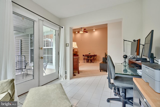 tiled office space featuring a ceiling fan, french doors, and carpet