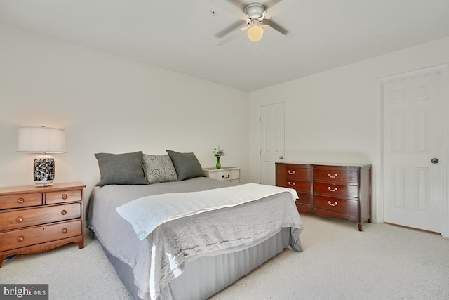 bedroom featuring light colored carpet and ceiling fan