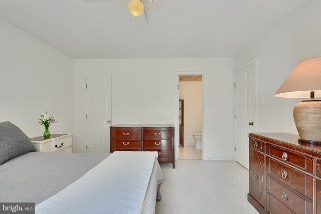 bedroom with ensuite bathroom and ceiling fan