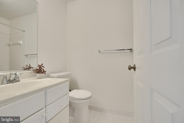 bathroom with vanity, walk in shower, toilet, and tile patterned flooring