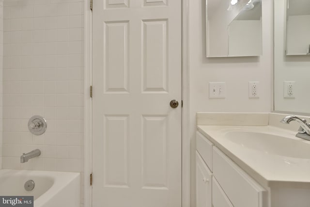 bathroom with vanity and bathtub / shower combination