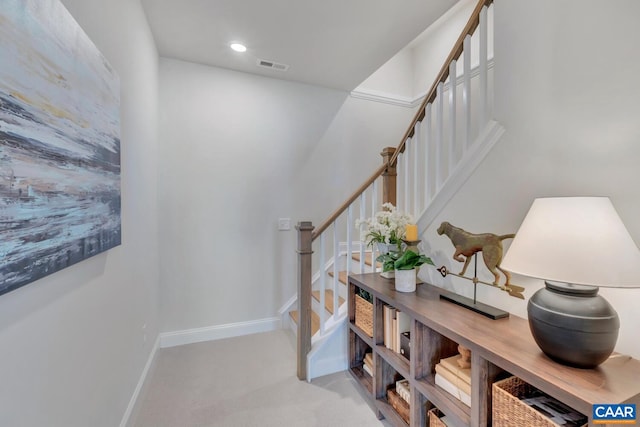 staircase with carpet flooring