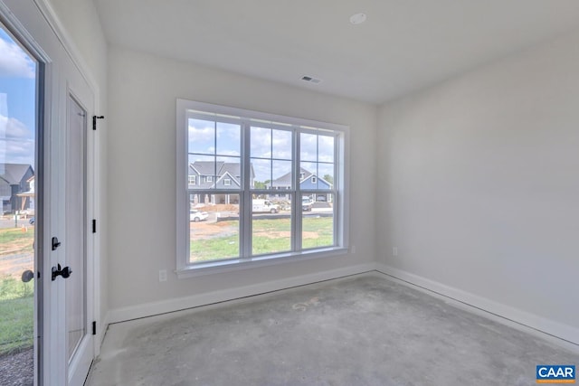 unfurnished room with a healthy amount of sunlight