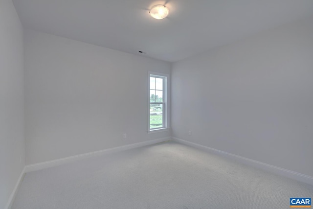 unfurnished room featuring carpet flooring