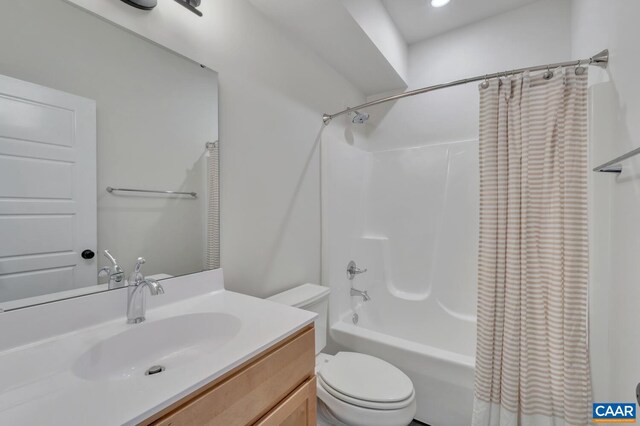 full bathroom with shower / bath combo, vanity, and toilet