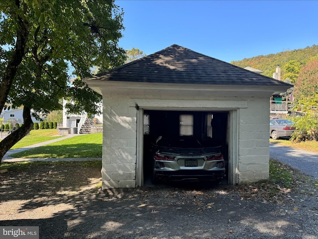 garage featuring a yard