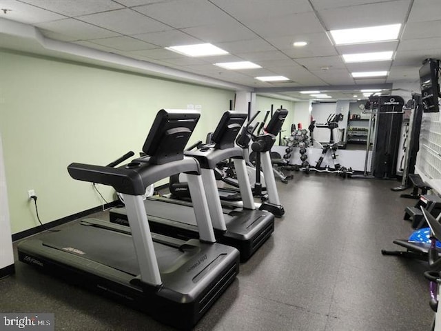 workout area featuring a paneled ceiling