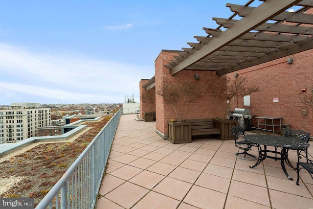 view of patio / terrace featuring a grill and a pergola