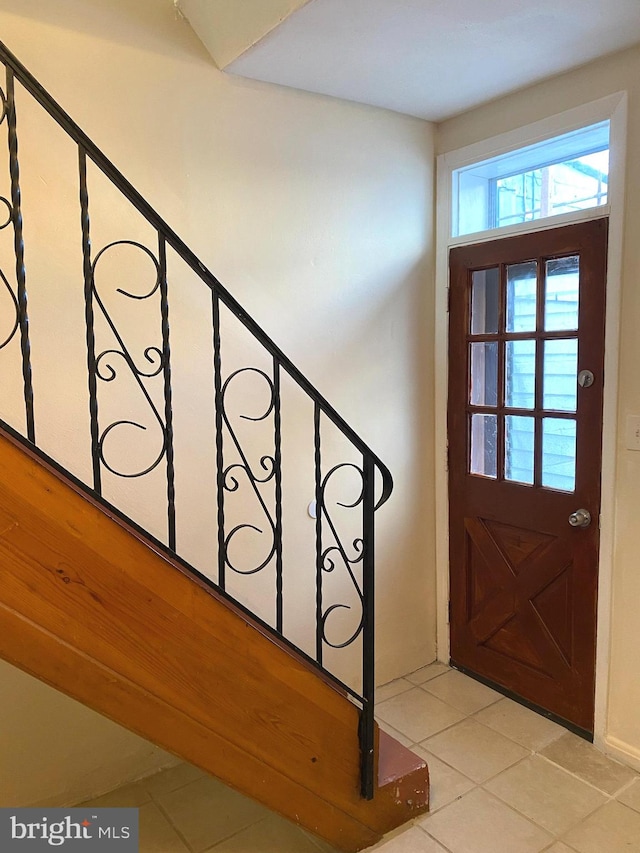 entrance foyer featuring light tile patterned floors