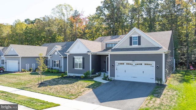 view of front of home with a garage and a front yard